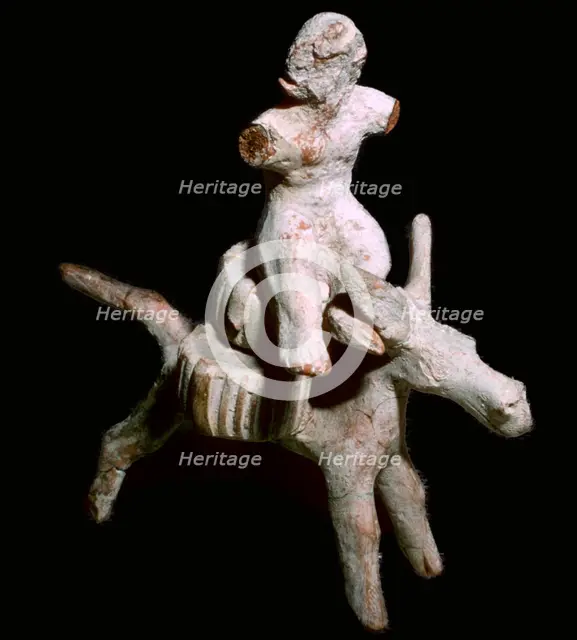 Greek terracotta figure of a man seated on three cheese on top of a mule, Corinthian. Artist: Unknown