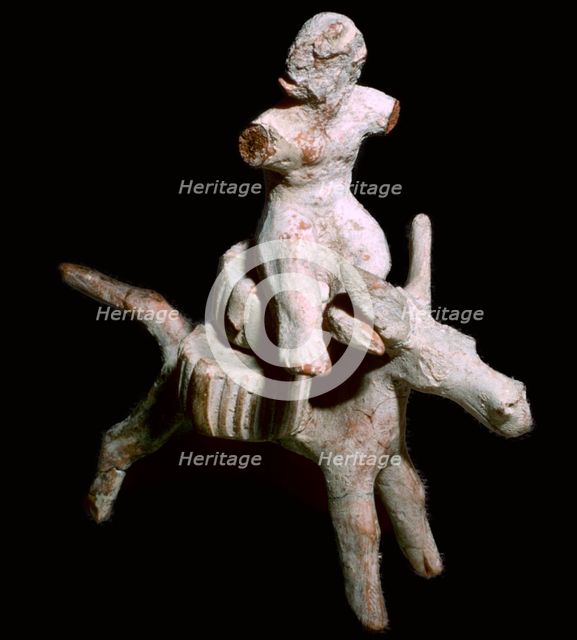 Greek terracotta figure of a man seated on three cheese on top of a mule, Corinthian. Artist: Unknown