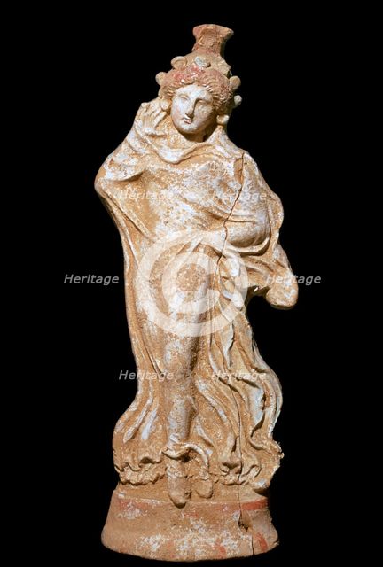 Greek terracotta of a woman in a flowing dress. Artist: Unknown