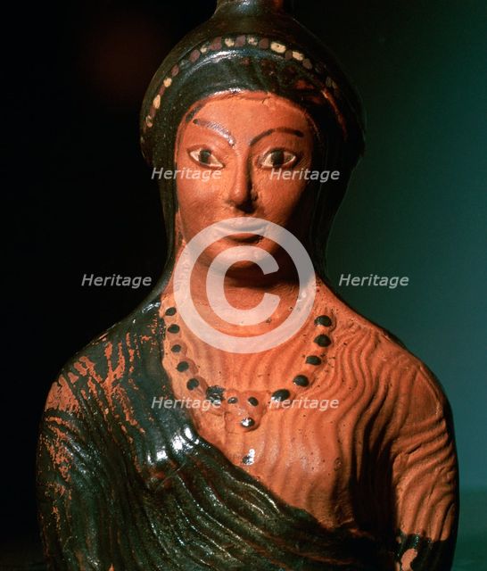 Greek terracotta scent bottle in the shape of a female bust. Artist: Unknown