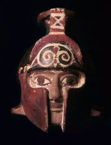 Greek terracotta scent bottle in the shape of a helmeted head, 6th century BC