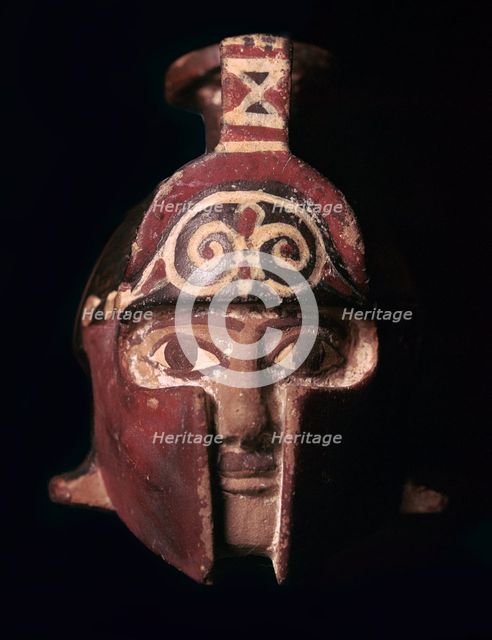 Greek terracotta scent bottle in the shape of a helmeted head, 6th century BC. Artist: Unknown