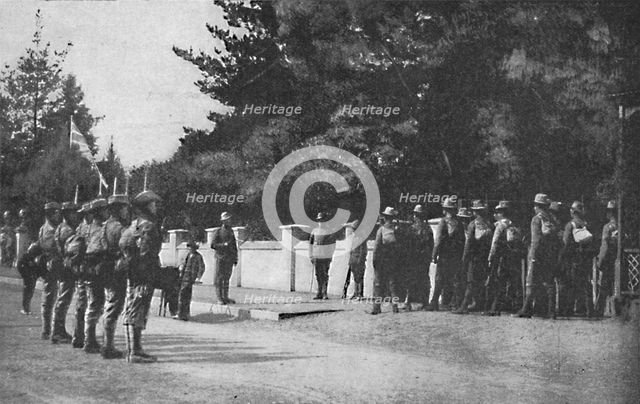 'Grenadier Guards (with their new hats) relieving guard at Lord Roberts's headquarters, Pretoria', 1 Artist: Unknown.