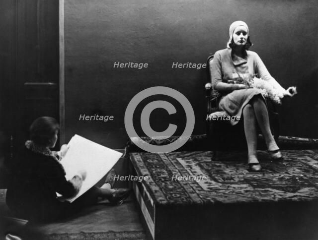 Greta Garbo is a model in the foyer of the Palladium, Malmo, Sweden, 1925.   Creator: Unknown.