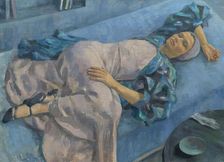 Grete Gamerith on a blue couch, 1936. Creator: Walther Gamerith