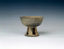 Grey pottery stem bowl with reticulated stem, United Silla Period, Korea, 8th century. Creator: Unknown