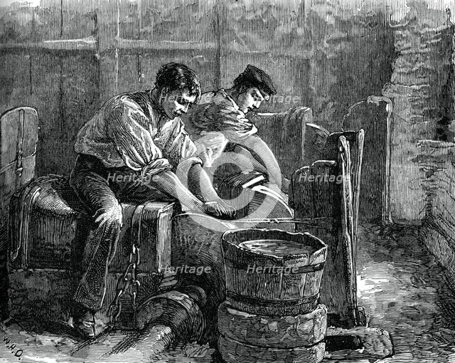 Grinders at work on a wheel, c1880. Artist: Unknown
