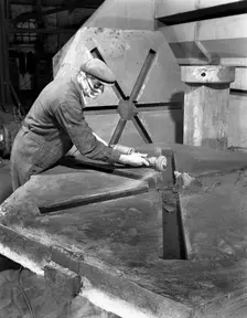 Grinding the flashing from a casting, AT Green & Sons Ltd, Rotherham, South Yorkshire, 1963. Creator: Michael Walters