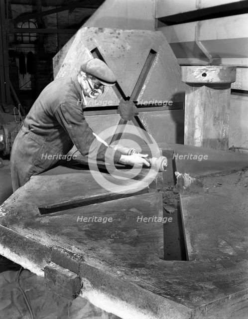 Grinding the flashing from a casting, AT Green & Sons Ltd, Rotherham, South Yorkshire, 1963. Artist: Michael Walters