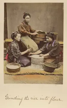 Grinding the rice into flour, about 1873-1883. Creator: Shinichi Suzuki I