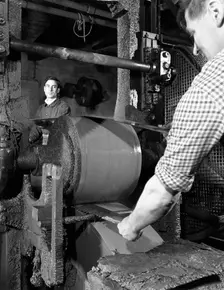 Grinding two metre saw blades at Slack Sellars & Co Ltd, Sheffield, South Yorkshire, 1963. Creator: Michael Walters