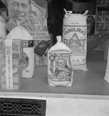 Grocery store window, Mebane, North Carolina, 1939. Creator: Dorothea Lange