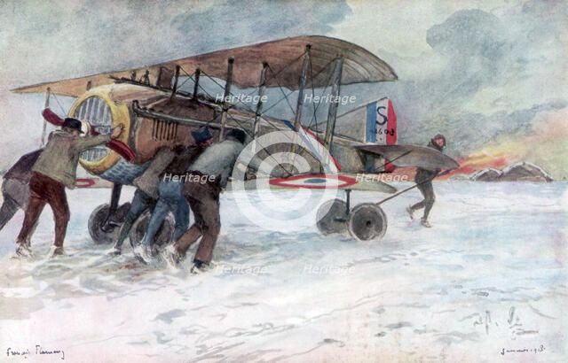 'Ground crew attending to a French Spad on a snow-covered field', 1918, (1926).Artist: Francois Flameng