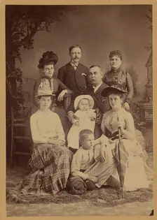 Group family portrait of eight members, 1889. Creator: SS Cornell