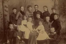 Group family portrait of fifteen people, 1870s. Creator: Unknown