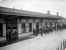 Group, including soldiers and policemen, wait outside Oxford Railway Station, Oxon, c1860-c1922. Artist: Henry Taunt