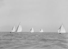 Group of 6 Metres racing downwind, 1911. Creator: Kirk & Sons of Cowes