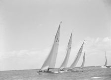 Group of 8 Metre sailing yachts racing close-hauled. Creator: Kirk & Sons of Cowes