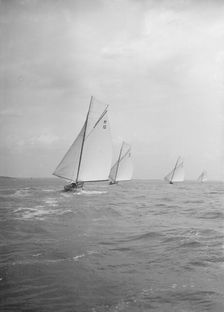 Group of 8 Metres sailing yachts racing downwind, 1913. Creator: Kirk & Sons of Cowes