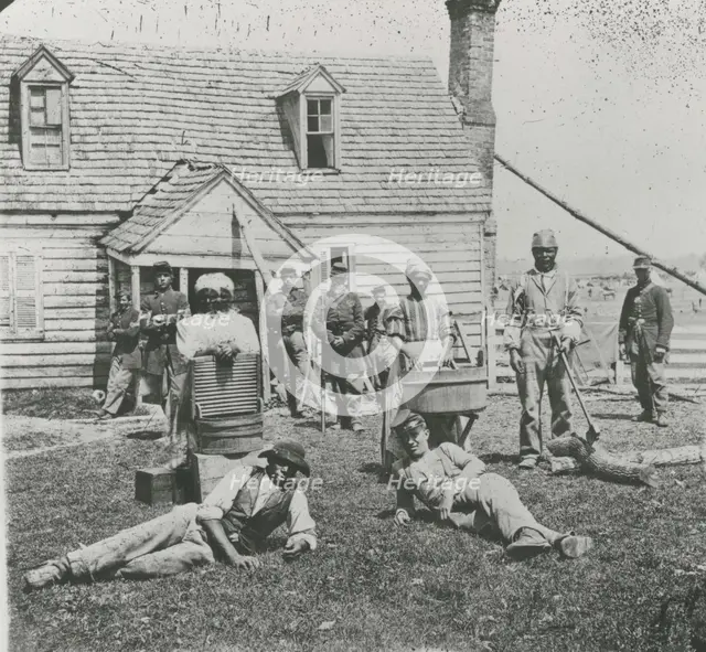 Group of contrabands at Allen's farm house near Williamsburg Road, in the vicinity..., May 1862. Creator: James F. Gibson.