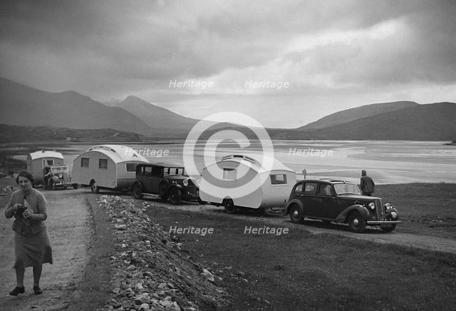 Group of cars and caravans camping in Scottish Highlands 1930's. Creator: Unknown.