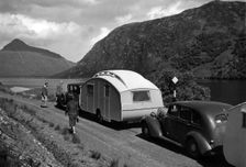 Group of cars and caravans camping in Scottish Highlands 1930's. Creator: Unknown