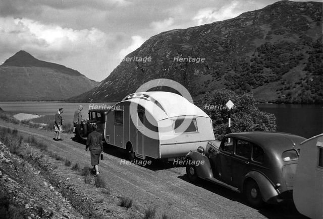 Group of cars and caravans camping in Scottish Highlands 1930's. Creator: Unknown.