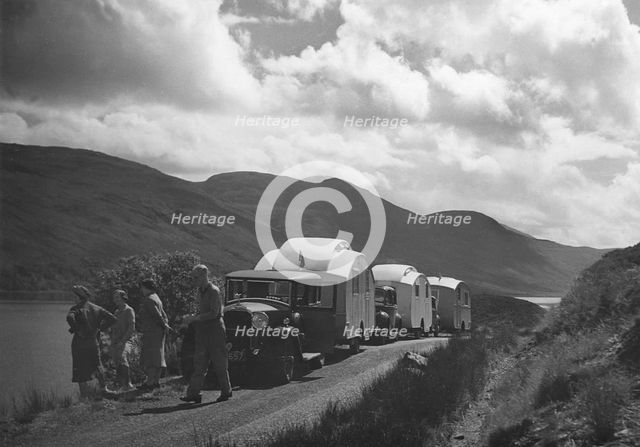 Group of cars and caravans camping in Scottish Highlands 1930's. Creator: Unknown.