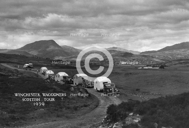 Group of cars and caravans camping in Scottish Highlands 1930's. Creator: Unknown.