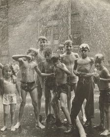 Group of children, mostly boys, gathered under sprinkler, in East Harlem, New York City, 1947 - 1951 Creator: Romulo Lachatanere