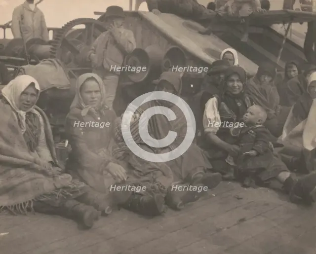 Group of emigrants (women and children) from eastern Europe on deck of the S.S. Amsterdam, 1899. Creator: Frances Benjamin Johnston.