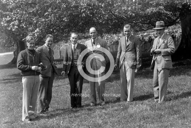 Group of men at Donington Park motor racing circuit, Leicestershire, c1930s. Artist: Bill Brunell.