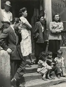 Group of men, women and children gathered on stoop, East Harlem, New York City, 1947 - 1951. Creator: Romulo Lachatanere