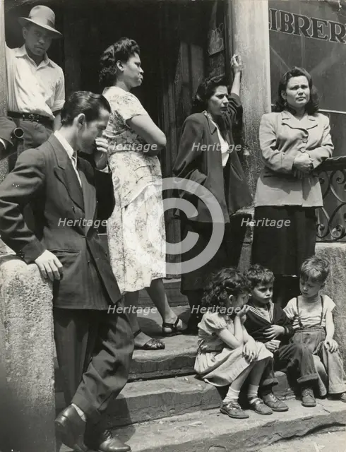 Group of men, women and children gathered on stoop, East Harlem, New York City, 1947 - 1951. Creator: Romulo Lachatanere.