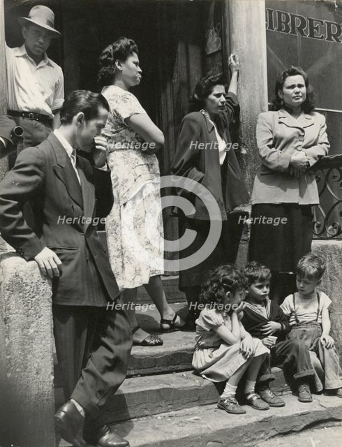 Group of men, women and children gathered on stoop, East Harlem, New York City, 1947 - 1951. Creator: Romulo Lachatanere.