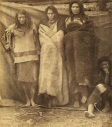 Group of Native Americans, three standing, one seated on the ground, possibly..., 1860 or 1861. Creator: Unknown