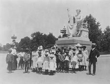 Group of school children in front of statue of George Washington, Washington, D.C., (1899?). Creator: Frances Benjamin Johnston
