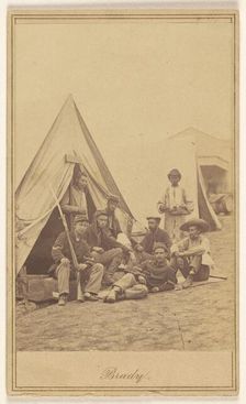 Group of seven soldiers and one black servant at a campsite, about 1862. Creator: Mathew Brady