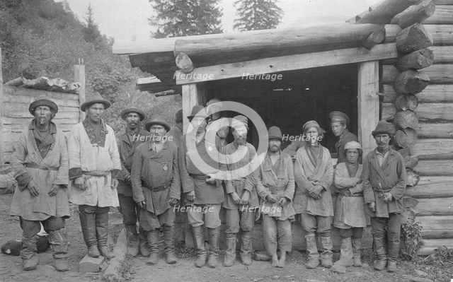 Group of Shoria Men with Village Headmen by a House, 1913. Creator: GI Ivanov.