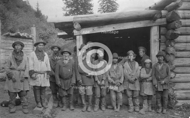 Group of Shoria Men with Village Headmen by a House, 1913. Creator: GI Ivanov.