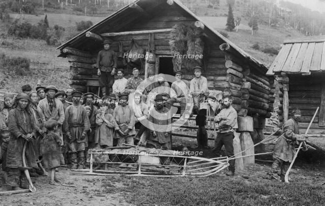 Group of Shoria Men; a Hunter, in Front, Equipped for a Winter Hunt by the Members..., 1913. Creator: GI Ivanov.