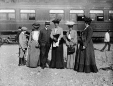 Group of people posed with railroad car behind them, Denver, Colorado, (1903?). Creator: Frances Benjamin Johnston
