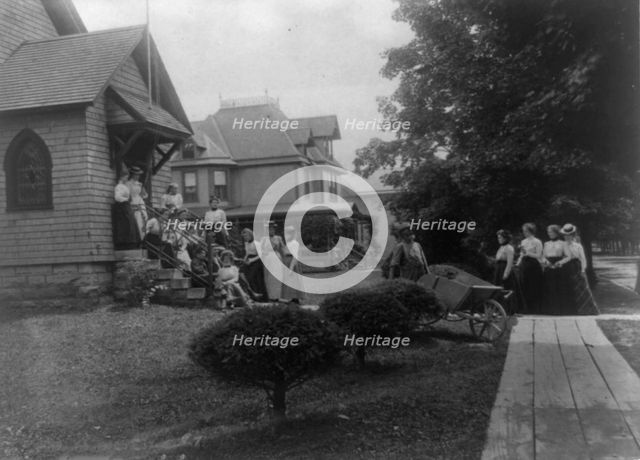 Group of women and a few boys outside Roycroft shop, East Aurora, N.Y., 1900. Creator: Frances Benjamin Johnston.