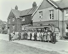 Group of women visitors in front of a school, Croydon, 1937