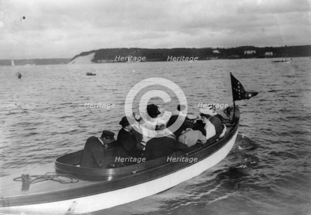 Group of well-dressed men and women in motorboat, Oyster Bay, Long Island, N.Y., 1905. Creator: Frances Benjamin Johnston.