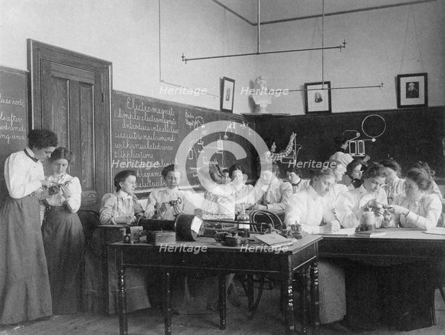 Group of young women studying electro-magnets in normal school, Washington, D.C., (1899?). Creator: Frances Benjamin Johnston.