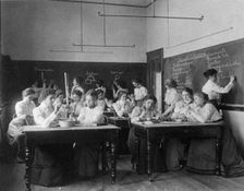 Group of young women performing atmospheric pressure experiments while studying..., (1899?). Creator: Frances Benjamin Johnston
