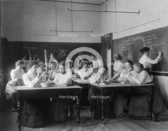 Group of young women performing atmospheric pressure experiments while studying..., (1899?). Creator: Frances Benjamin Johnston.