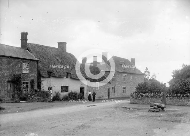 Group outside the Post Office, Coxwell, Oxfordshire, c1860-c1922. Artist: Henry Taunt