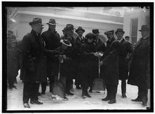 Group outside White House in snow, between 1913 and 1918. Creator: Harris & Ewing